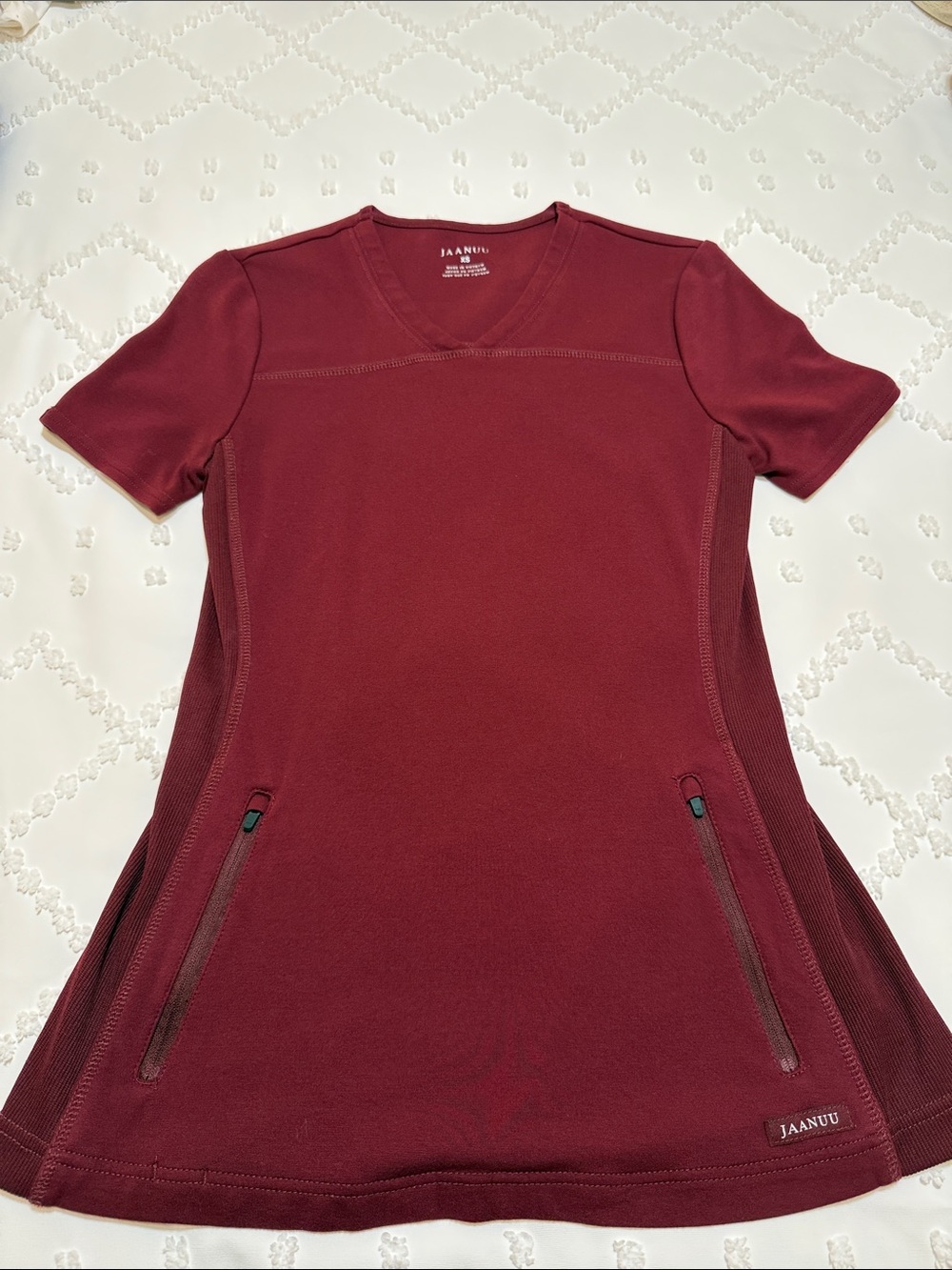 Jaanuu Burgundy V-Neck Scrub Top with Zip Pockets